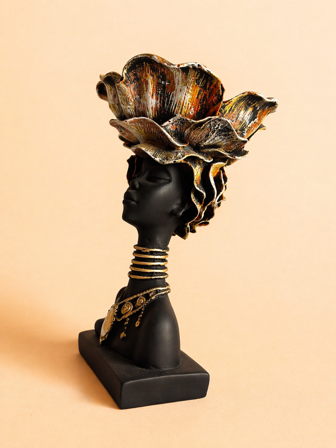 Handcrafted African lady head sculpture decor with crown, showcasing elegance and artistic expression.