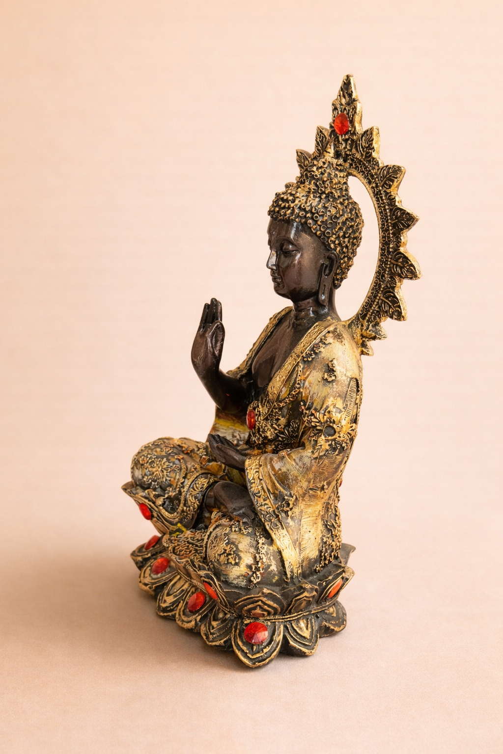 handcrafted Buddha idol with red stone