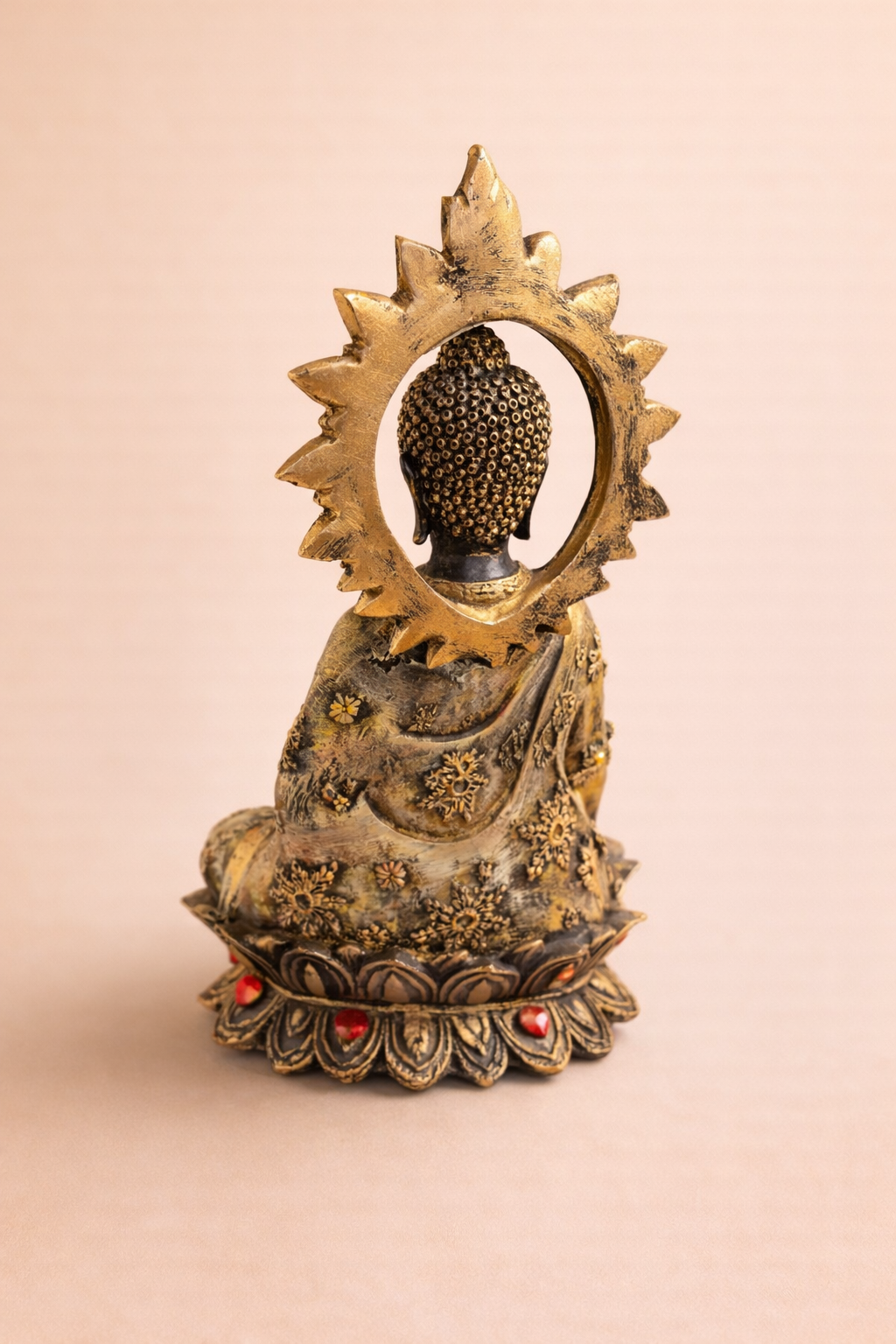 handcrafted Buddha idol with red stone