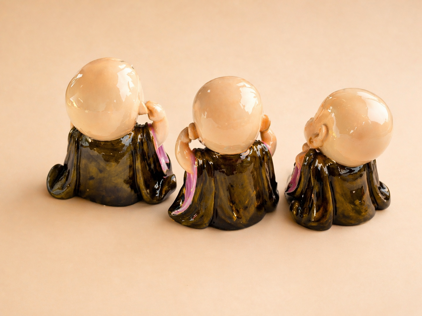 three wise monk figurines