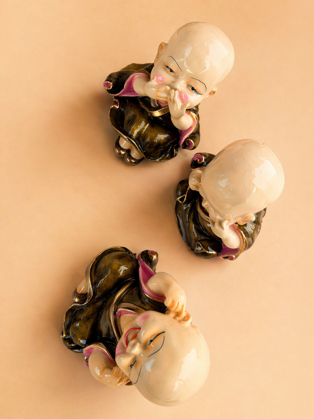 three wise monk figurines